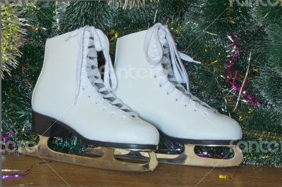 New year`s gift - the beautiful woman skates.