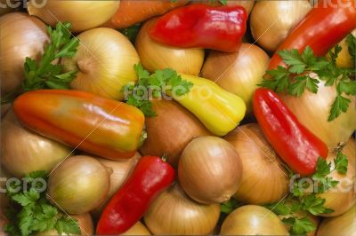 Red, yellow , green pepper, onion and parsley leaves.