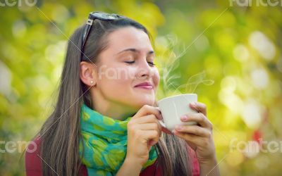 Beautiful Girl enjoy a coffee in Nature