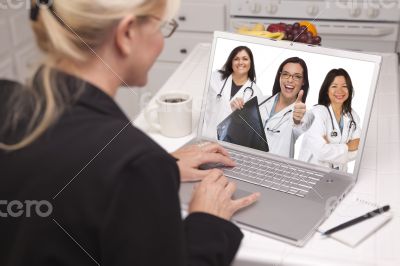 Woman Using Laptop Viewing Three Doctors with Thumbs Up