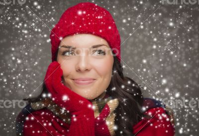 Mixed Race Woman Wearing Winter Hat and Gloves Enjoys Snowfall