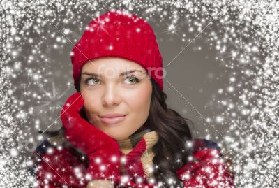 Mixed Race Woman Wearing Winter Hat and Gloves Enjoys Snowfall