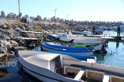 Boats near the jetty boat station on a sunny day.