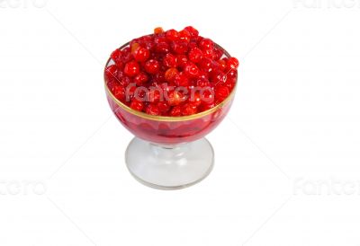 Viburnum berries in syrup on a white background.