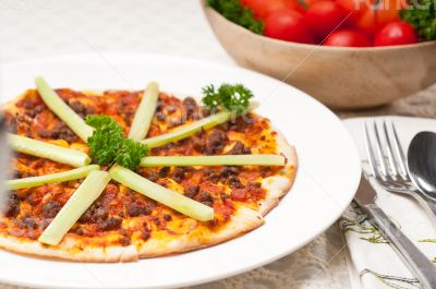 Turkish beef pizza with cucumber on top