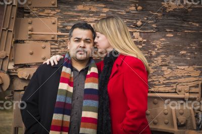 Mixed Race Couple Portrait in Winter Clothing Against Rustic Tra