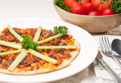 Turkish beef pizza with cucumber on top