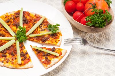 Turkish beef pizza with cucumber on top