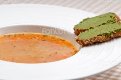Italian minestrone soup with pesto crostini on side
