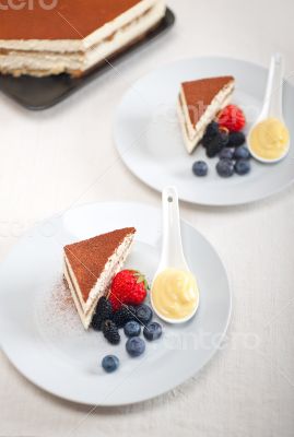 tiramisu dessert with berries and cream