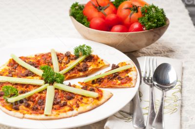 Turkish beef pizza with cucumber on top