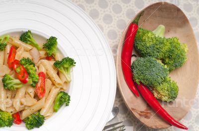 Italian penne pasta with broccoli and chili pepper