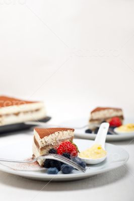 tiramisu dessert with berries and cream