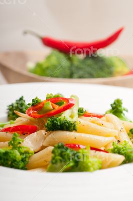 Italian penne pasta with broccoli and chili pepper