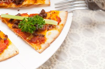 Turkish beef pizza with cucumber on top