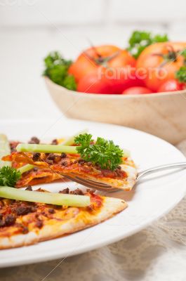 Turkish beef pizza with cucumber on top