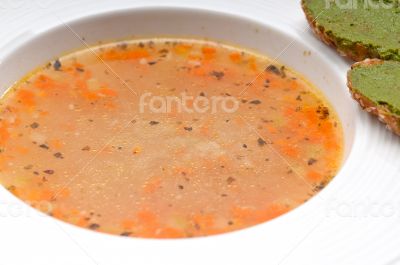 Italian minestrone soup with pesto crostini on side