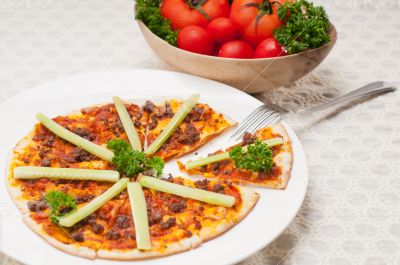 Turkish beef pizza with cucumber on top