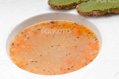 Italian minestrone soup with pesto crostini on side