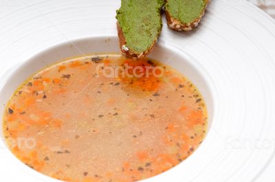 Italian minestrone soup with pesto crostini on side