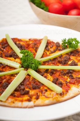 Turkish beef pizza with cucumber on top