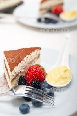 tiramisu dessert with berries and cream