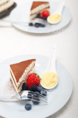 tiramisu dessert with berries and cream