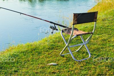 Comfortable place for fishing at the river and caught fish