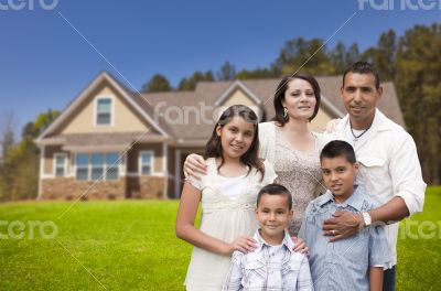 Young Hispanic Family in Front of Their New Home