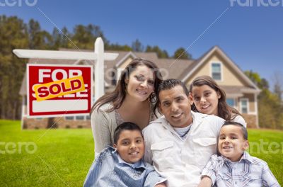 Hispanic Family, New Home and Sold Real Estate Sign