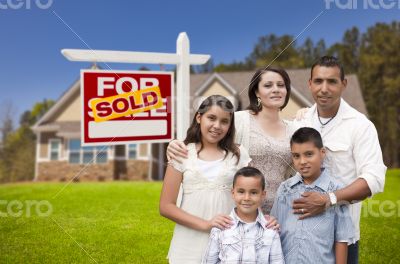 Hispanic Family, New Home and Sold Real Estate Sign