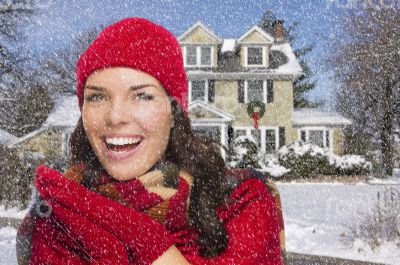 Smiling Mixed Race Woman in Winter Clothing Outside in Snow