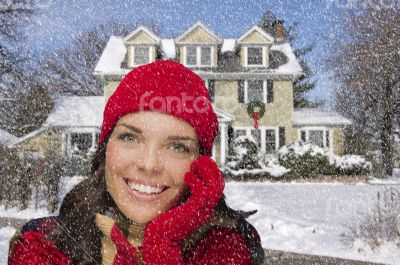 Smiling Mixed Race Woman in Winter Clothing Outside in Snow