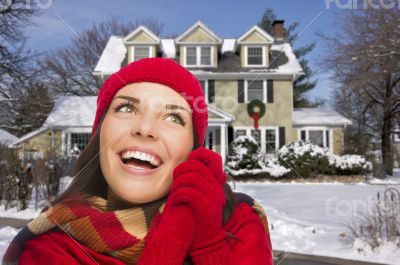 Smiling Mixed Race Woman in Winter Clothing Outside in Snow