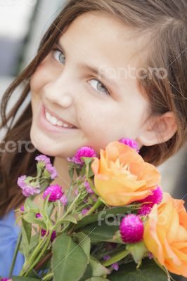 Pretty Young Girl Holding Flower Bouquet at the Market