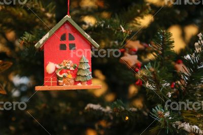 Bear Santa Claus is decorating the Christmas Tree