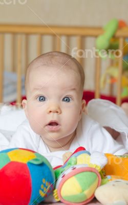 Baby looking surprised at camera