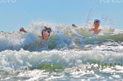 happy kids playing on beach