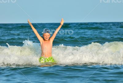 Young boy enjoying the sea