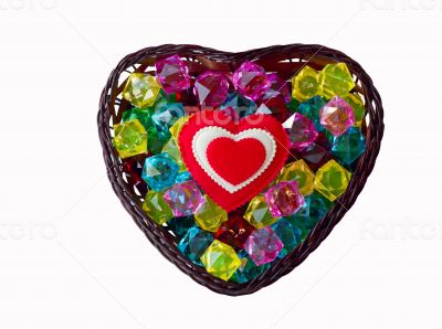 Decorative basket as heart with colored glass and a red heart. Decorative basket as heart with colored glass and a red heart.