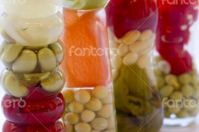 Decorative bottle with canned vegetables. 