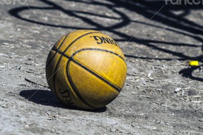basketball lies in the yard