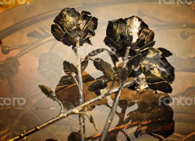 The shiny metal forged roses, handmade