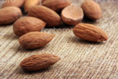 Almonds on wooden background 