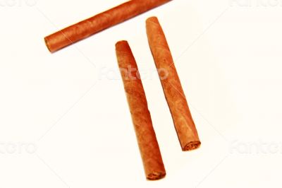 Natural cigarillo isolated on the white background