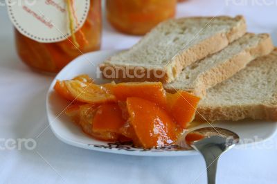 marmalade with pieces of tangerine on the plate marmalade with pieces of tangerine on the plate