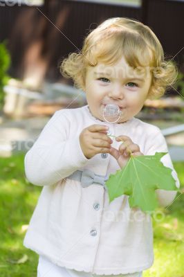 Cute infant with nipple