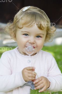 Cute infant with nipple