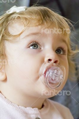 Cute infant with nipple