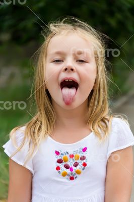 Cute girl with put out tongue
